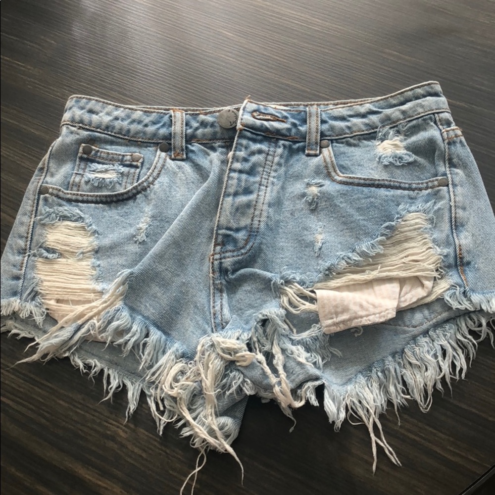 Light wash distressed jean shorts